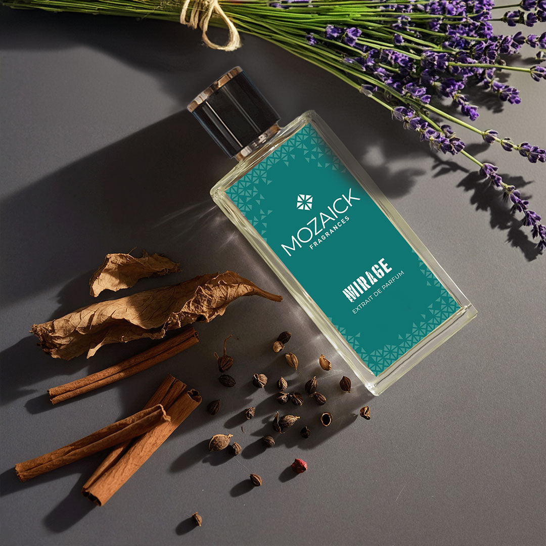 MIRAGE Extrait de Parfum 50 ml by MOZAICK – bottle on a gray surface with lavender, cinnamon sticks and spices